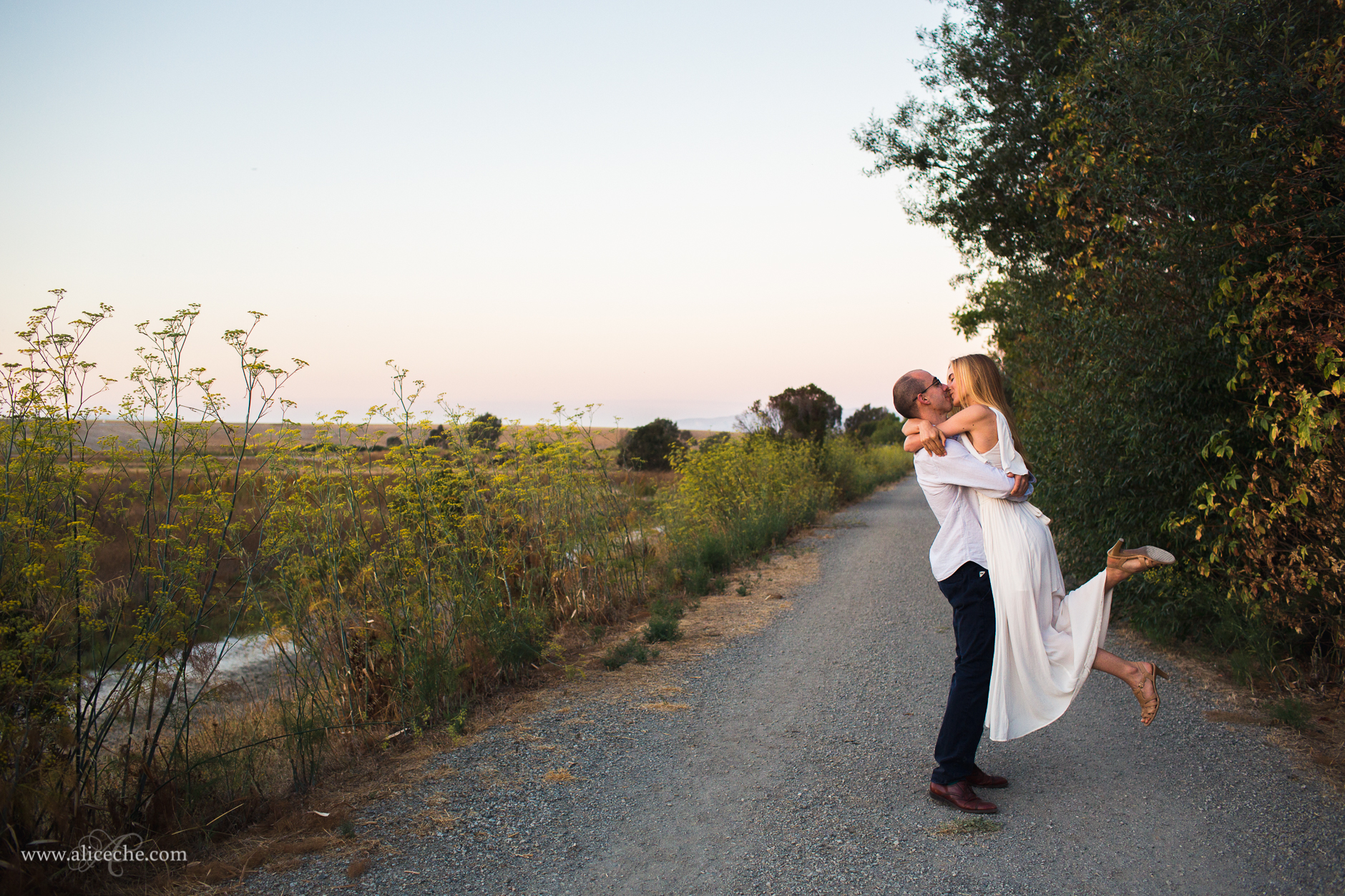 Palo Alto Engagement Photographer Guy Lifting Fiance and Kissing