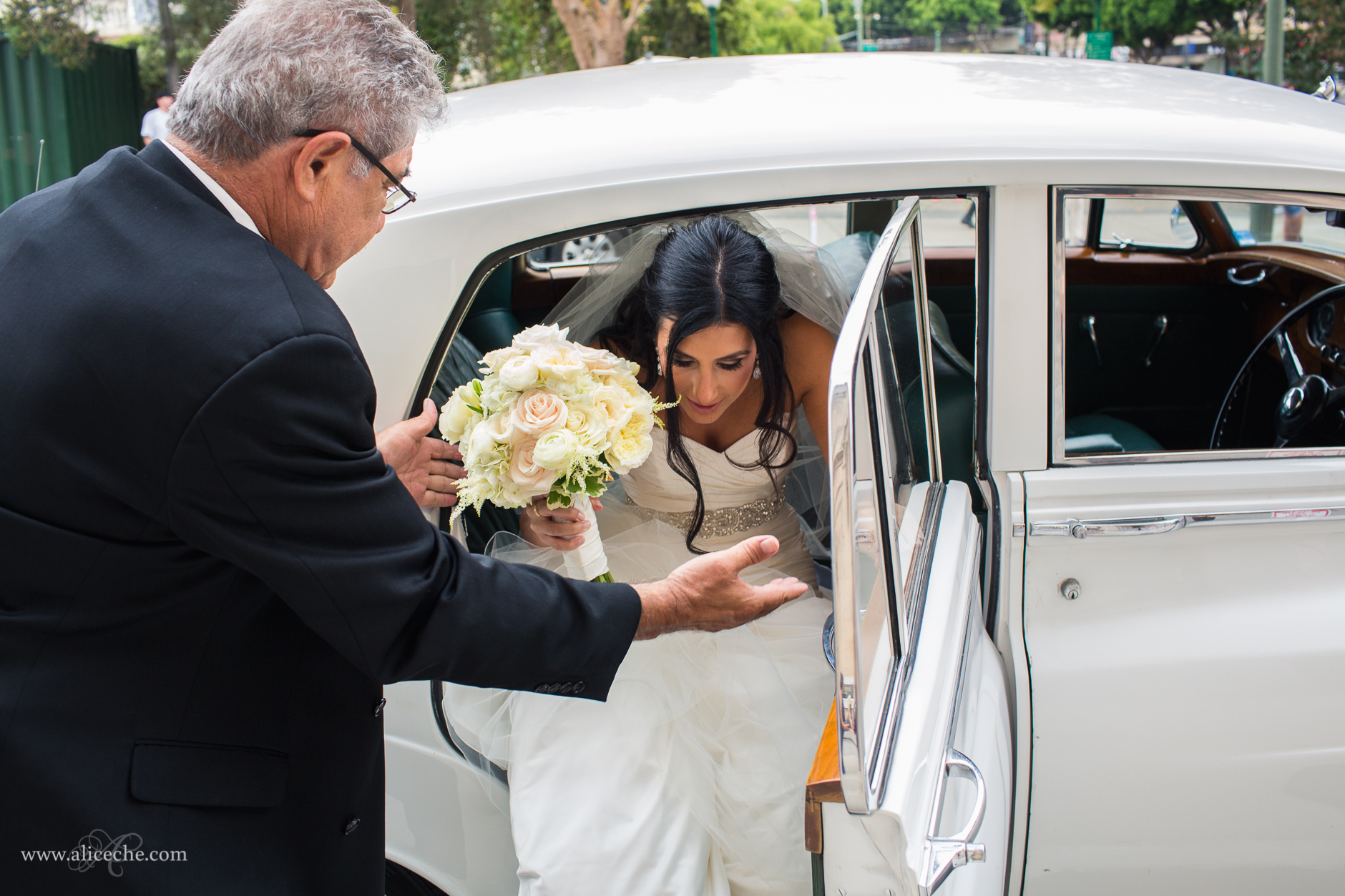 bride-exiting-rolls-royce-san-francisco-wedding