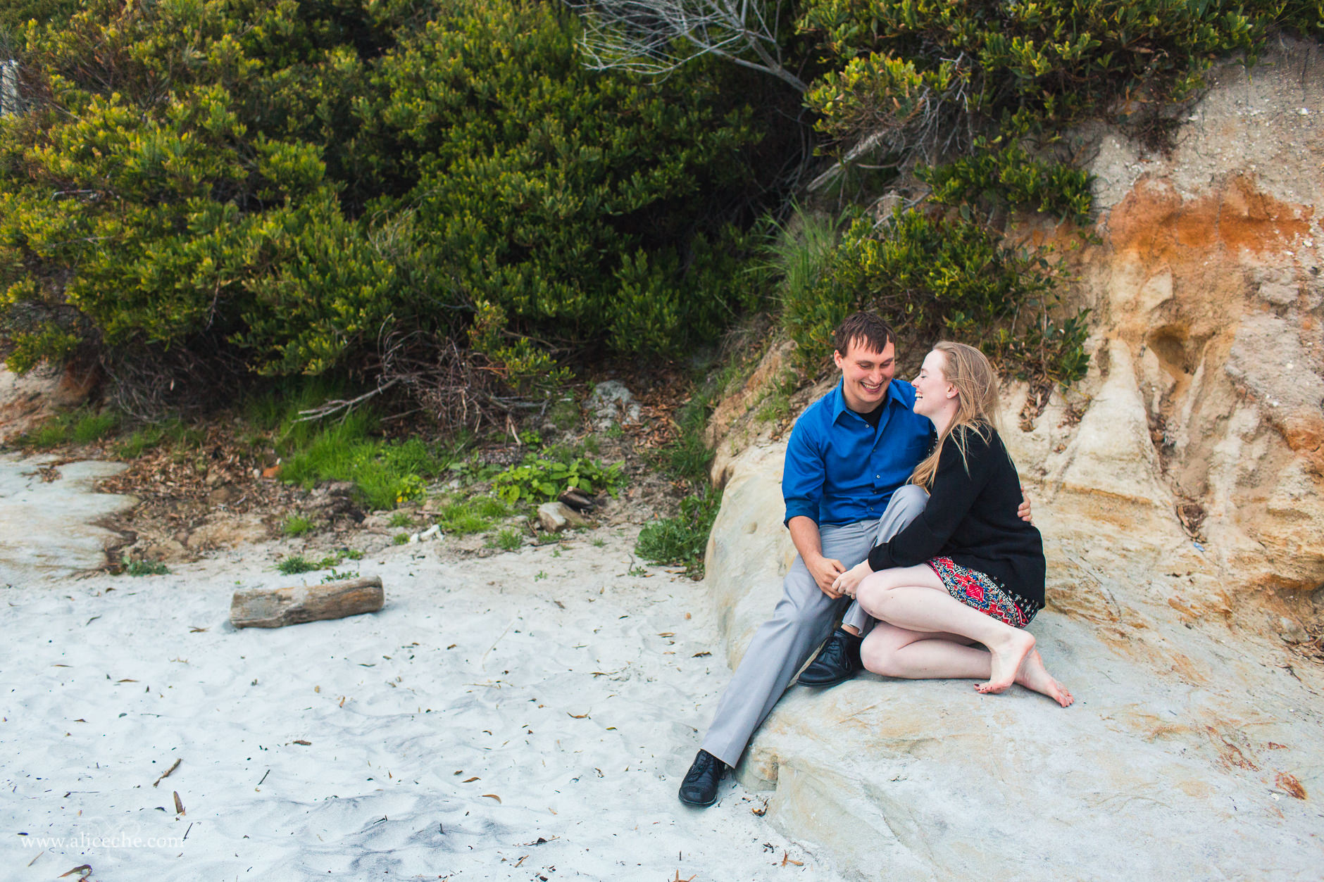 carmel beach proposal san francisco bay area photographer couple laughing on rocks