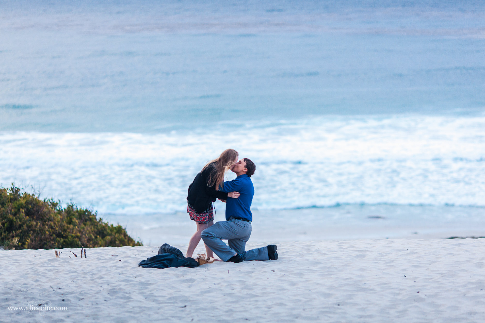 carmel beach proposal san francisco bay area photographer girl kissing fiance on one knee