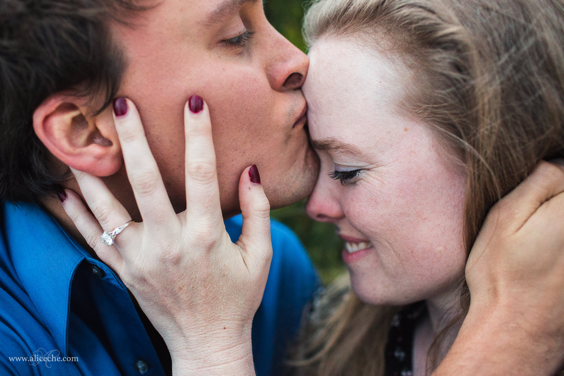 carmel beach proposal san francisco bay area photographer guy kissing girl on forehead