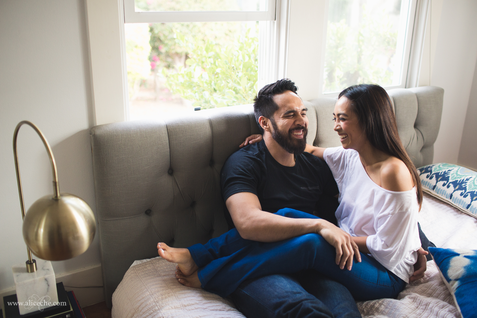 san francisco intimate at home engagement couple cuddled on bed