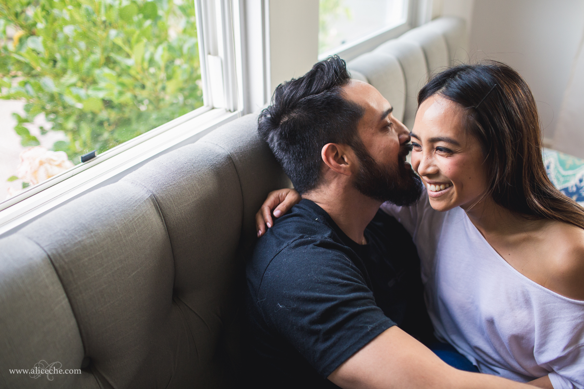 san francisco intimate at home engagement couple whispering a secret