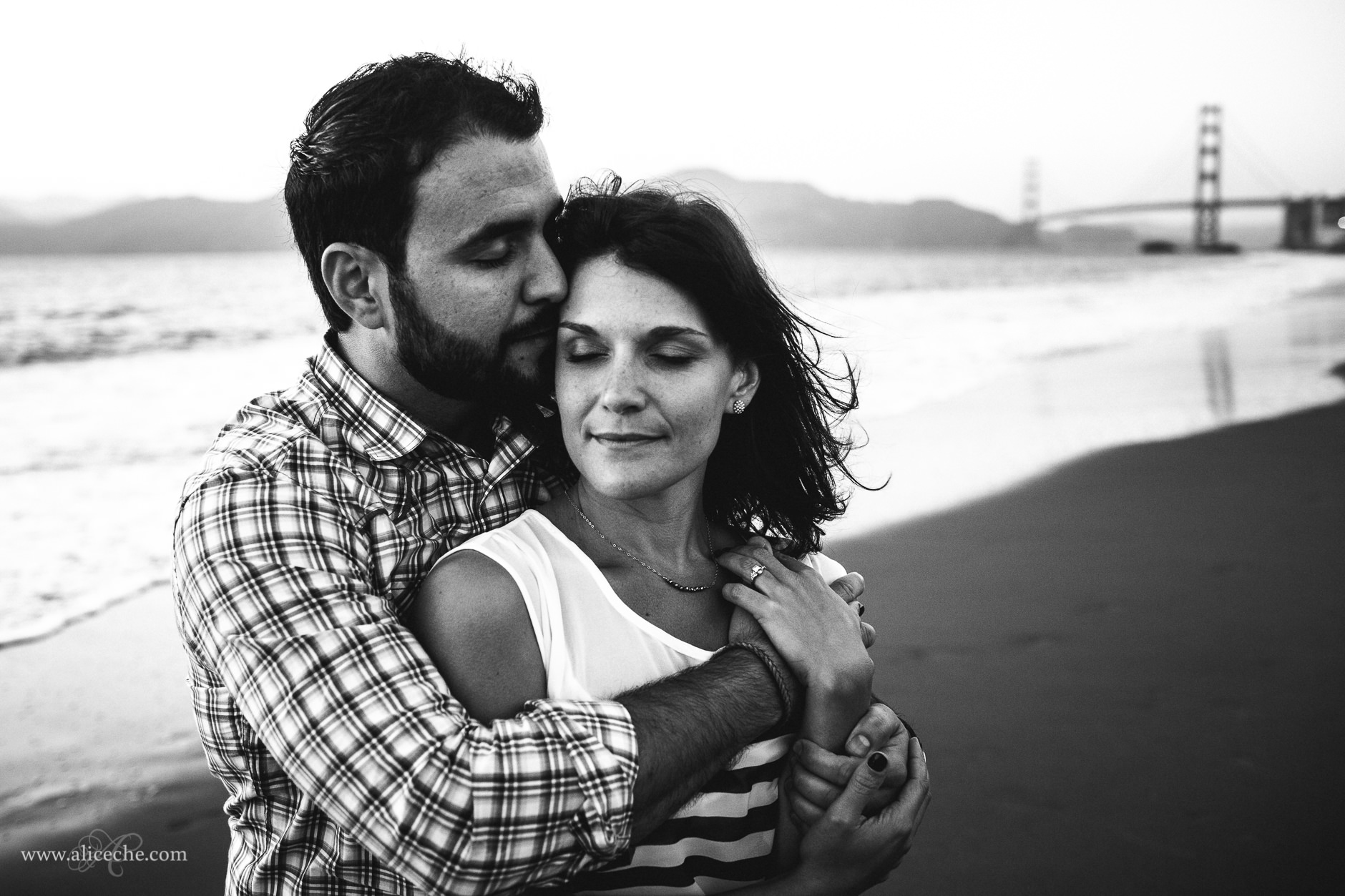 gorgeous baker beach engagement couple in front of golden gate bridge black and white san francisco wedding photographer