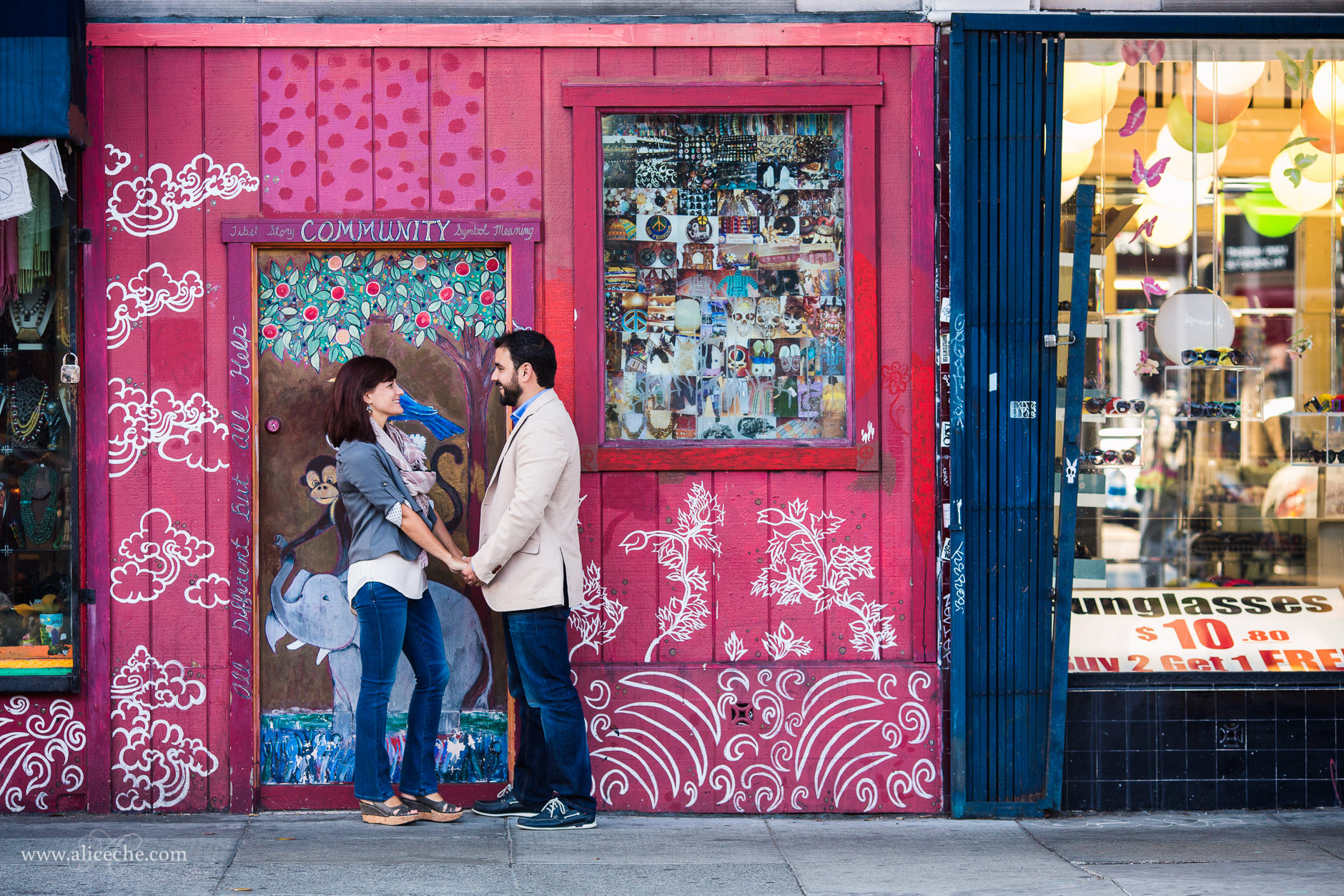 haight-ashbury-engagement-session-san-francisco-wedding-photographer-couple-in-front-of-pink-doors