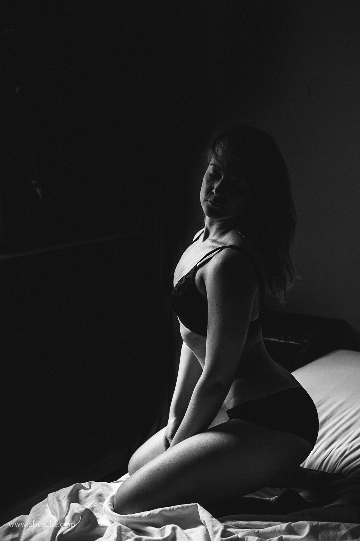 San Francisco Boudoir Photographer Moody Woman Sitting On Bed