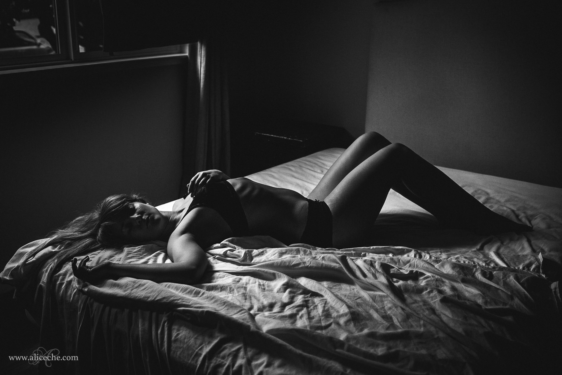 San Francisco Boudoir Photographer Black and White Woman Lying on Bed