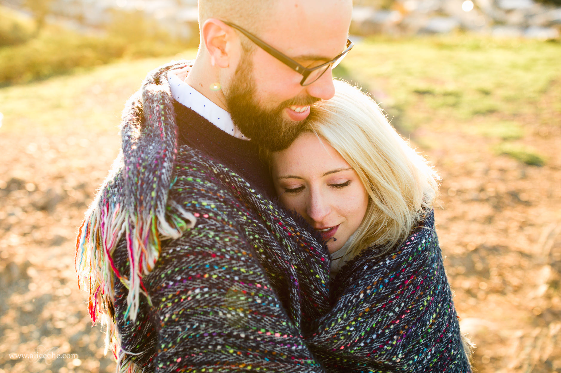 Twin Peaks Engagement Session San Francisco Photographer Sweet Couple wrapped in scarf above the city