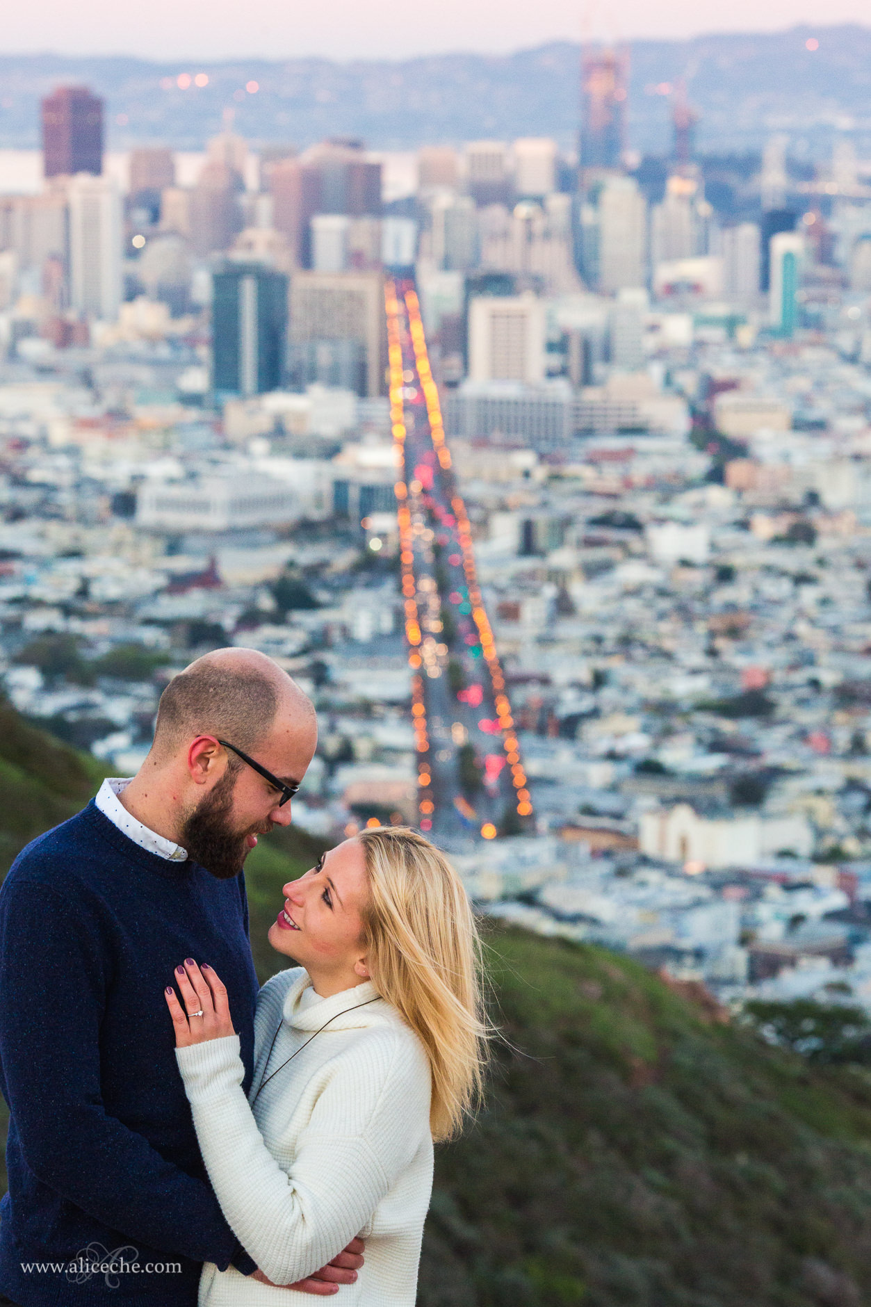 Twin Peaks Engagement Session San Francisco Photographer Couple hugging in front of city