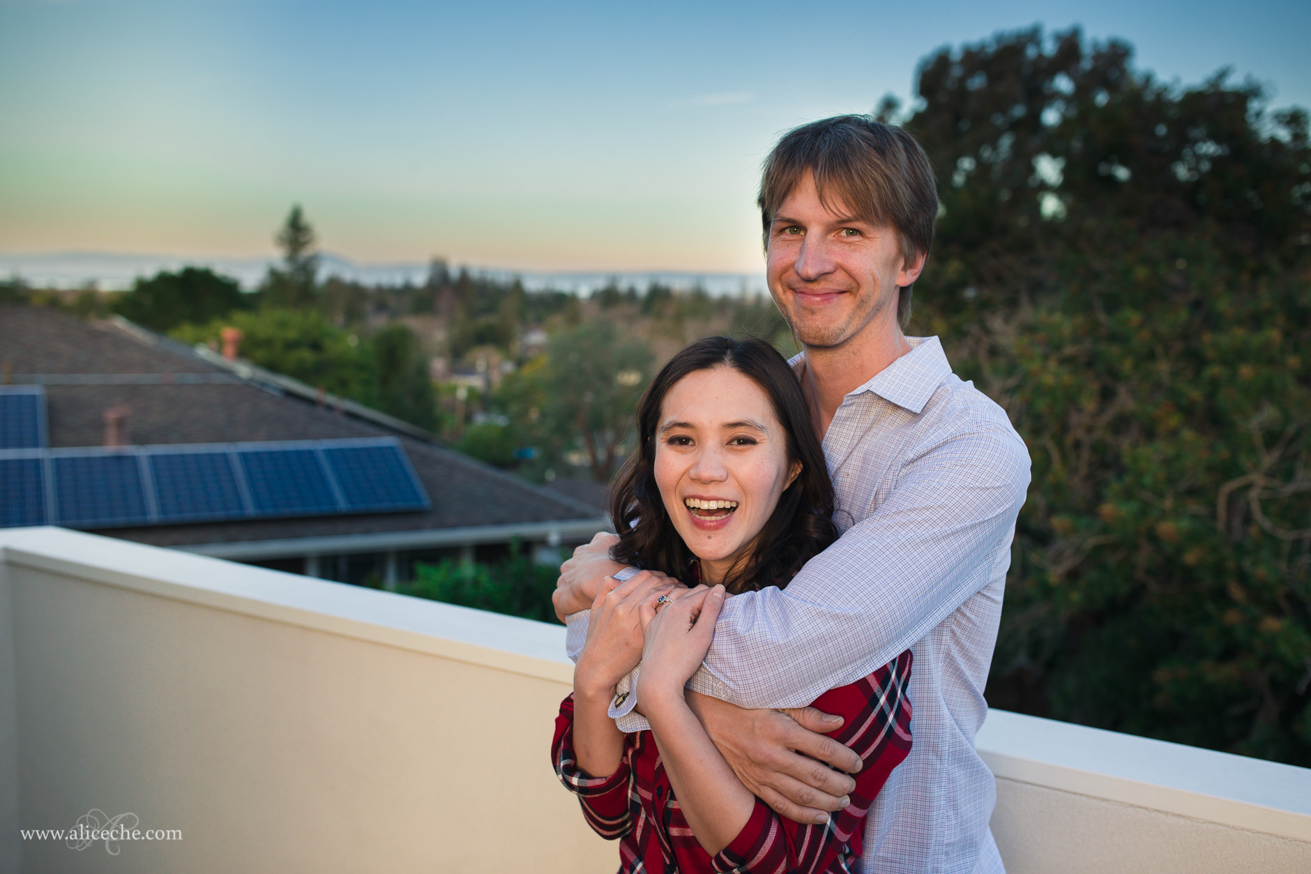 Redwood City In Home Engagement Session Couple Laughing on Rooftop