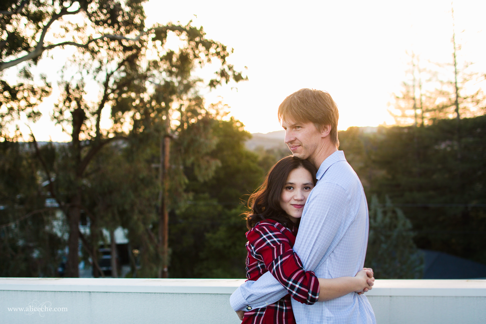 Redwood City In Home Engagement Session Couple Hugging at Sunset