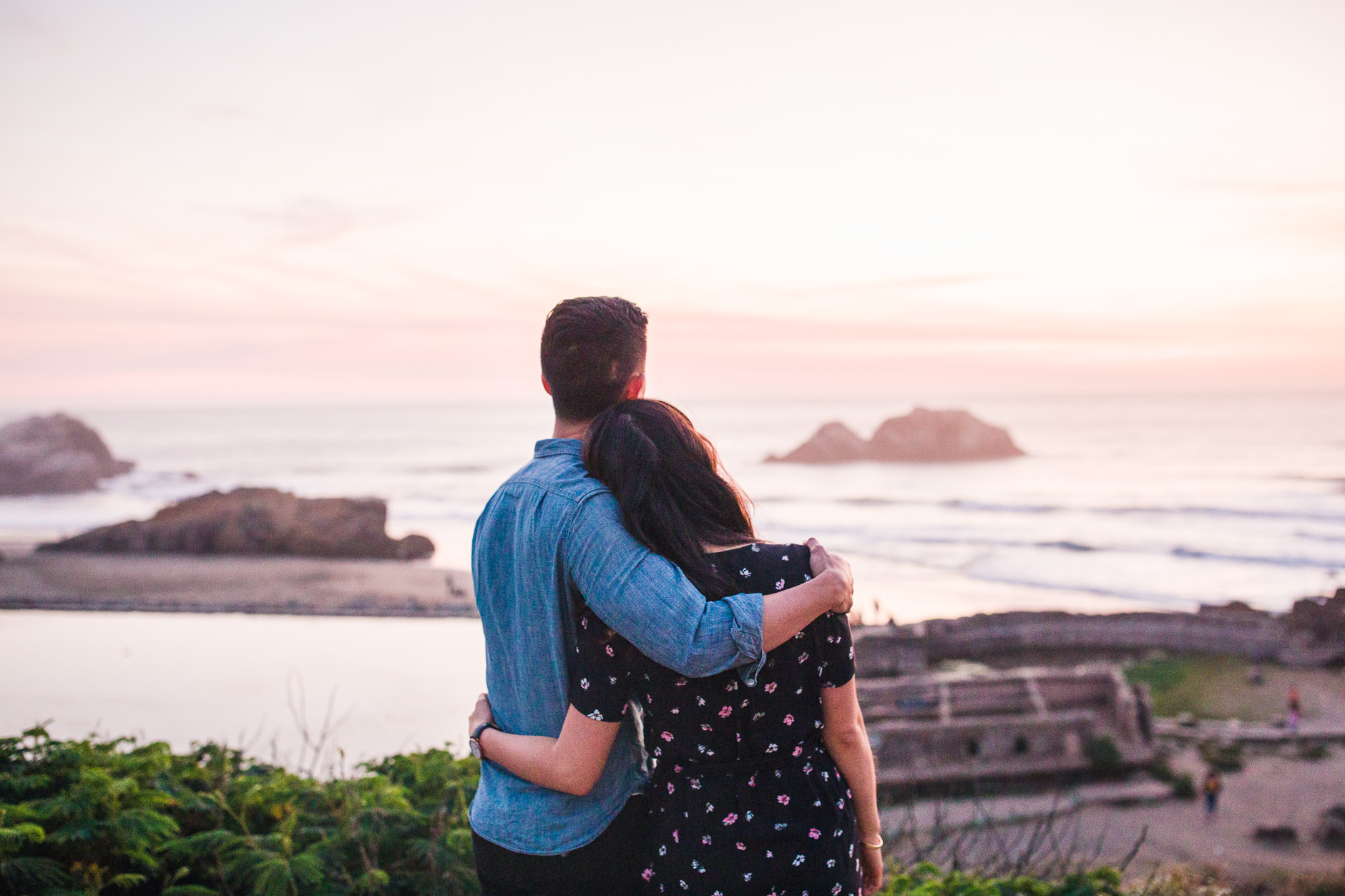 Couple watching sunset at Sutro Baths