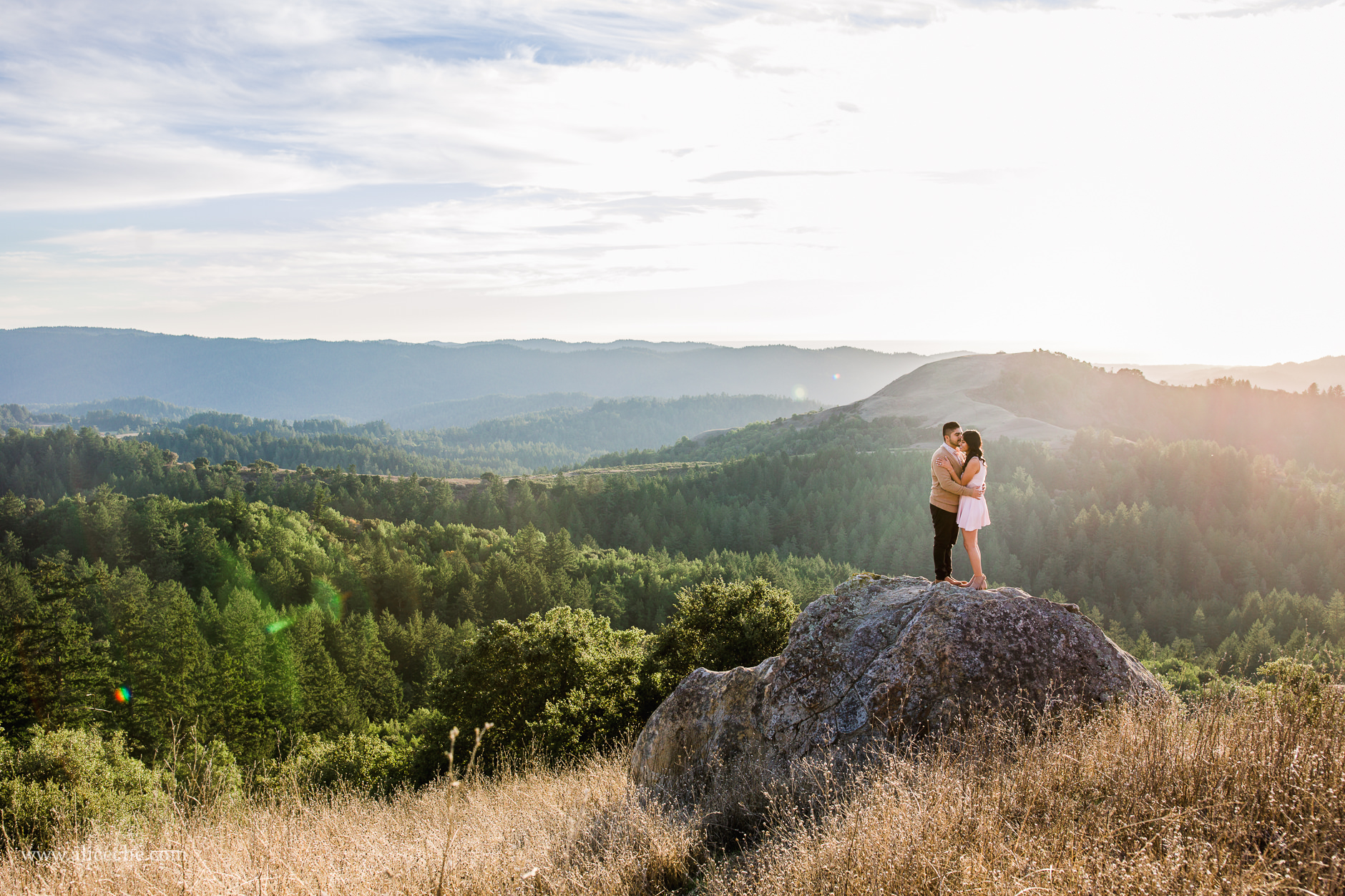 Russian Ridge Engagement Session Couple kissing on rock