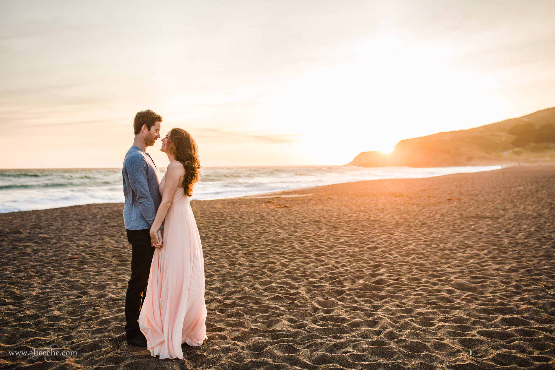 Rodeo Beach engagement session with blush maxi dress and golden light