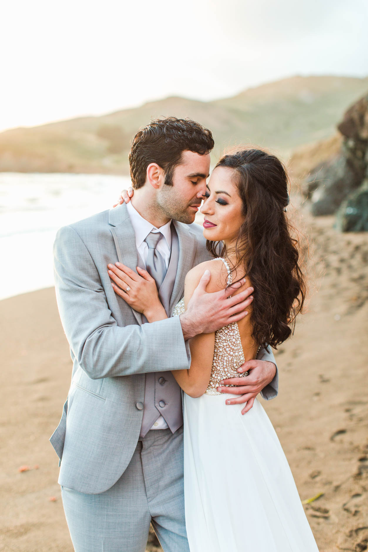 Intimate bride and groom portrait during windswept elopement