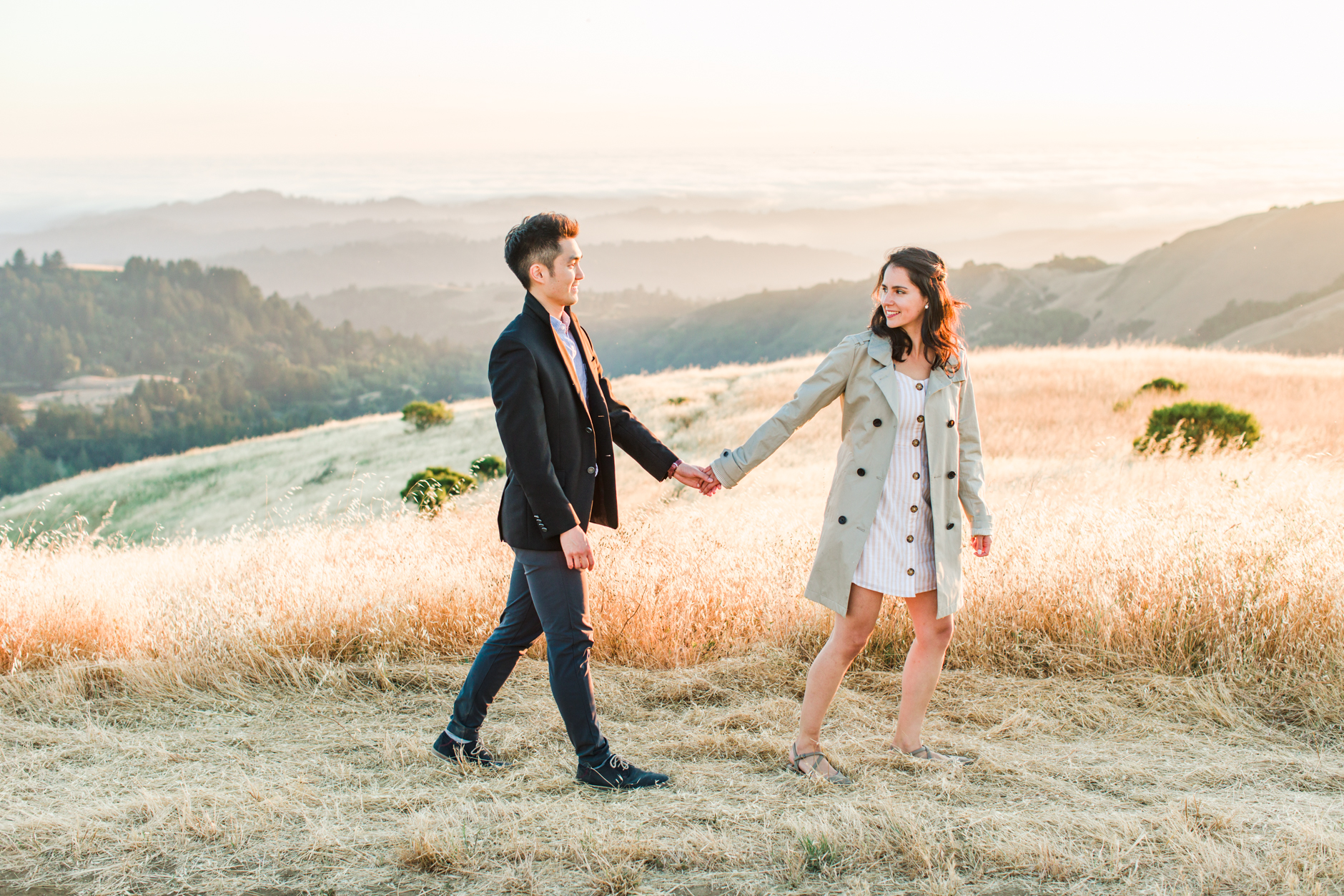 Silicon Valley engagement session bride leading groom in front of rolling hills
