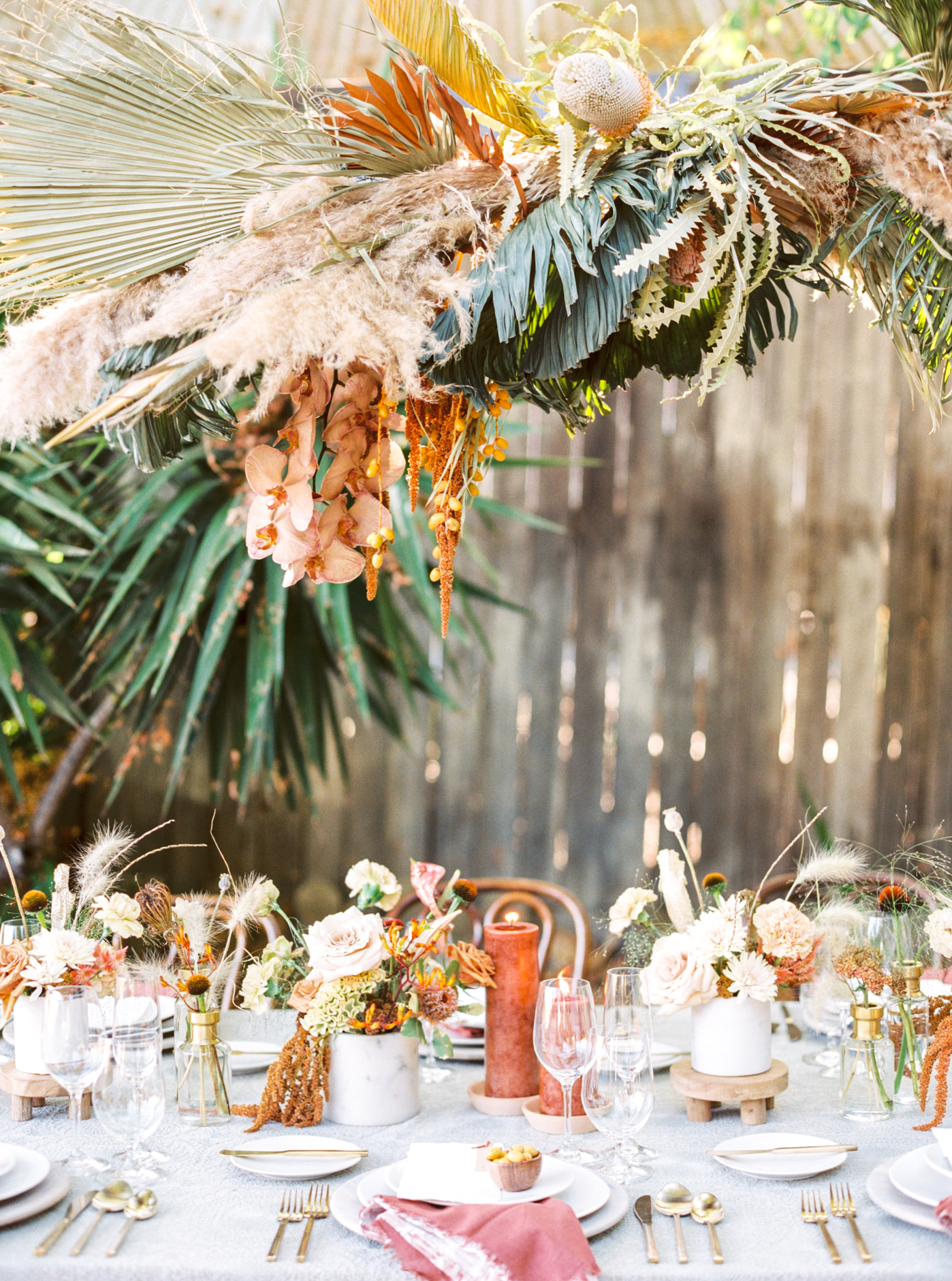 Reinstein Ranch Wedding Inspiration Shoot Tablescape with hanging dried floral installation and terracotta colors