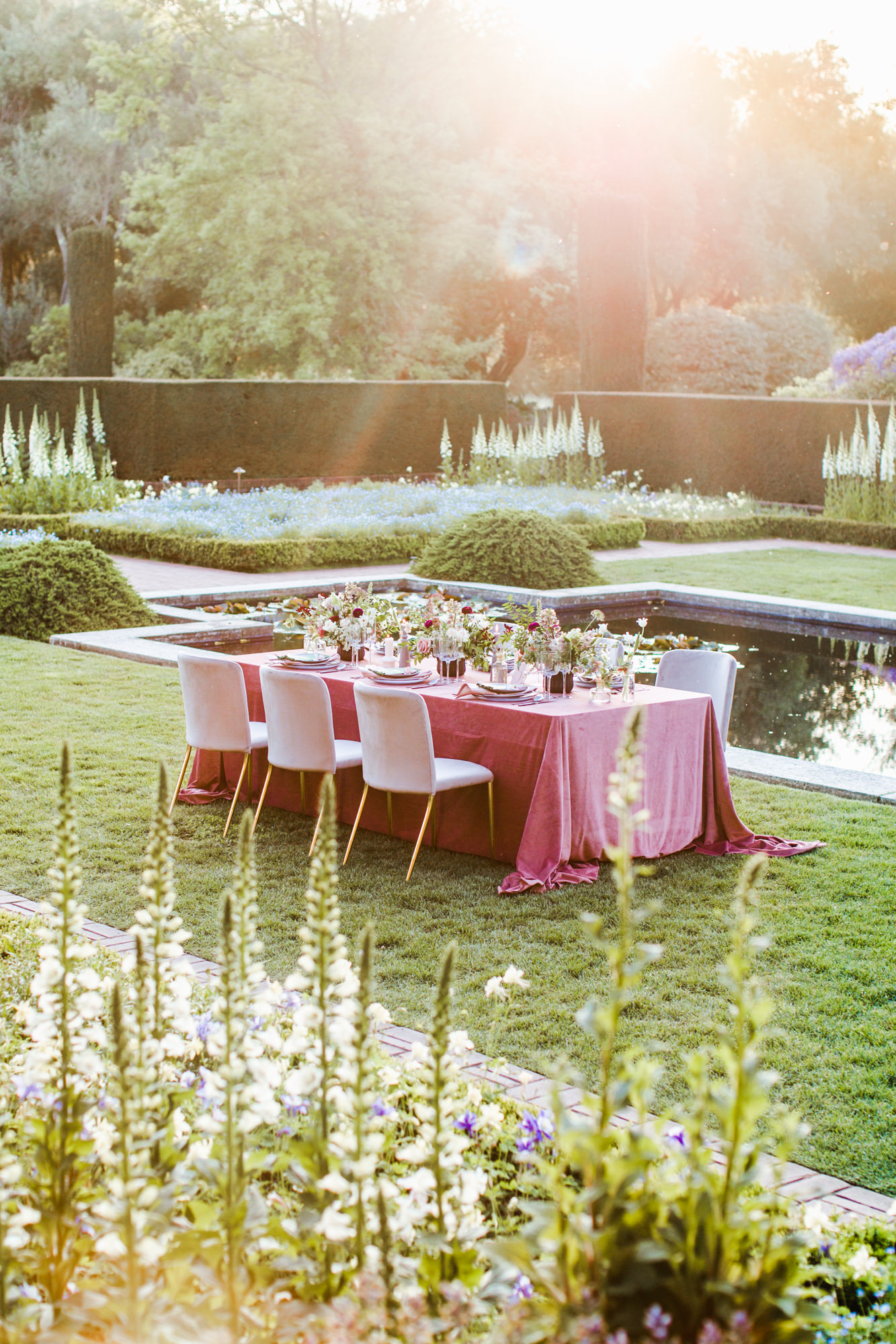 Charming mauve tablescape for a Filoli Garden wedding right by the beautiful pond surrounded by flowers