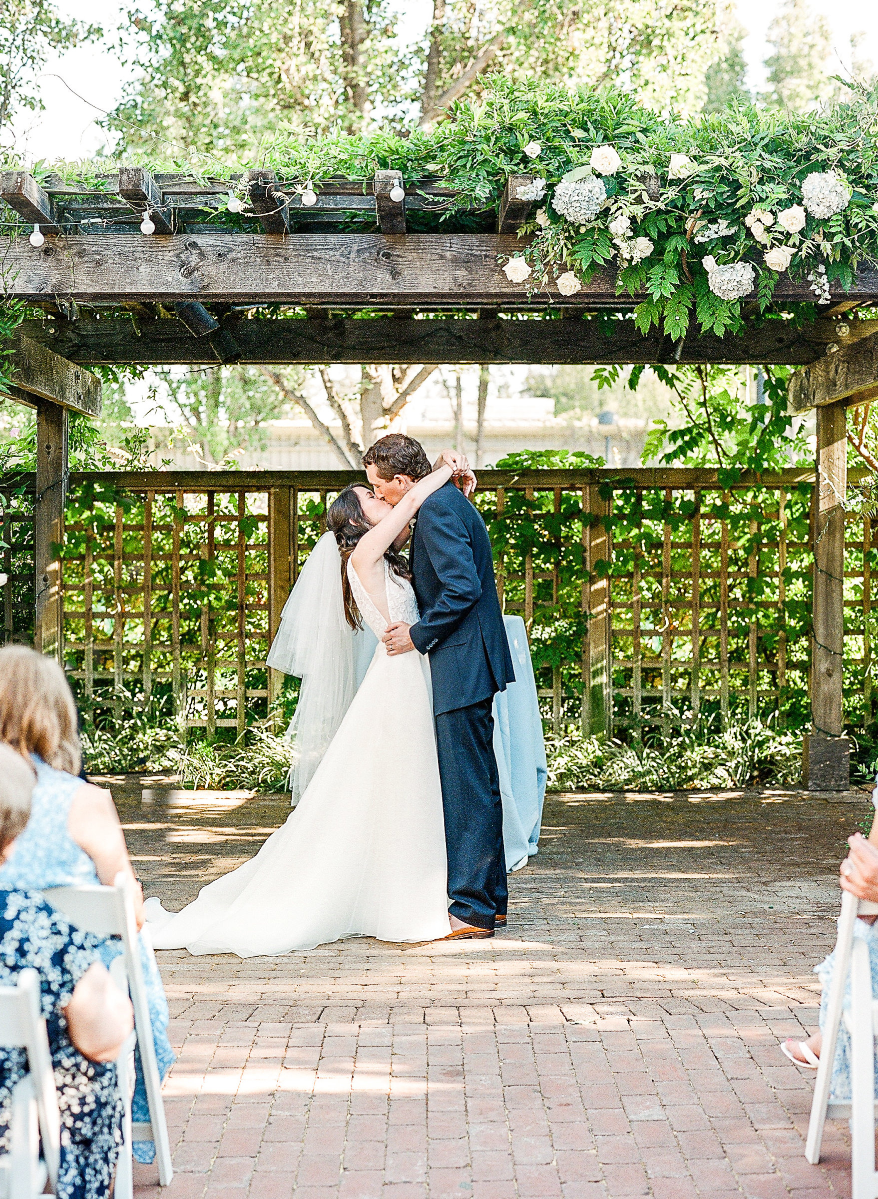 Bride and Groom's First Kiss at Classic Los Altos History Museum Garden Wedding