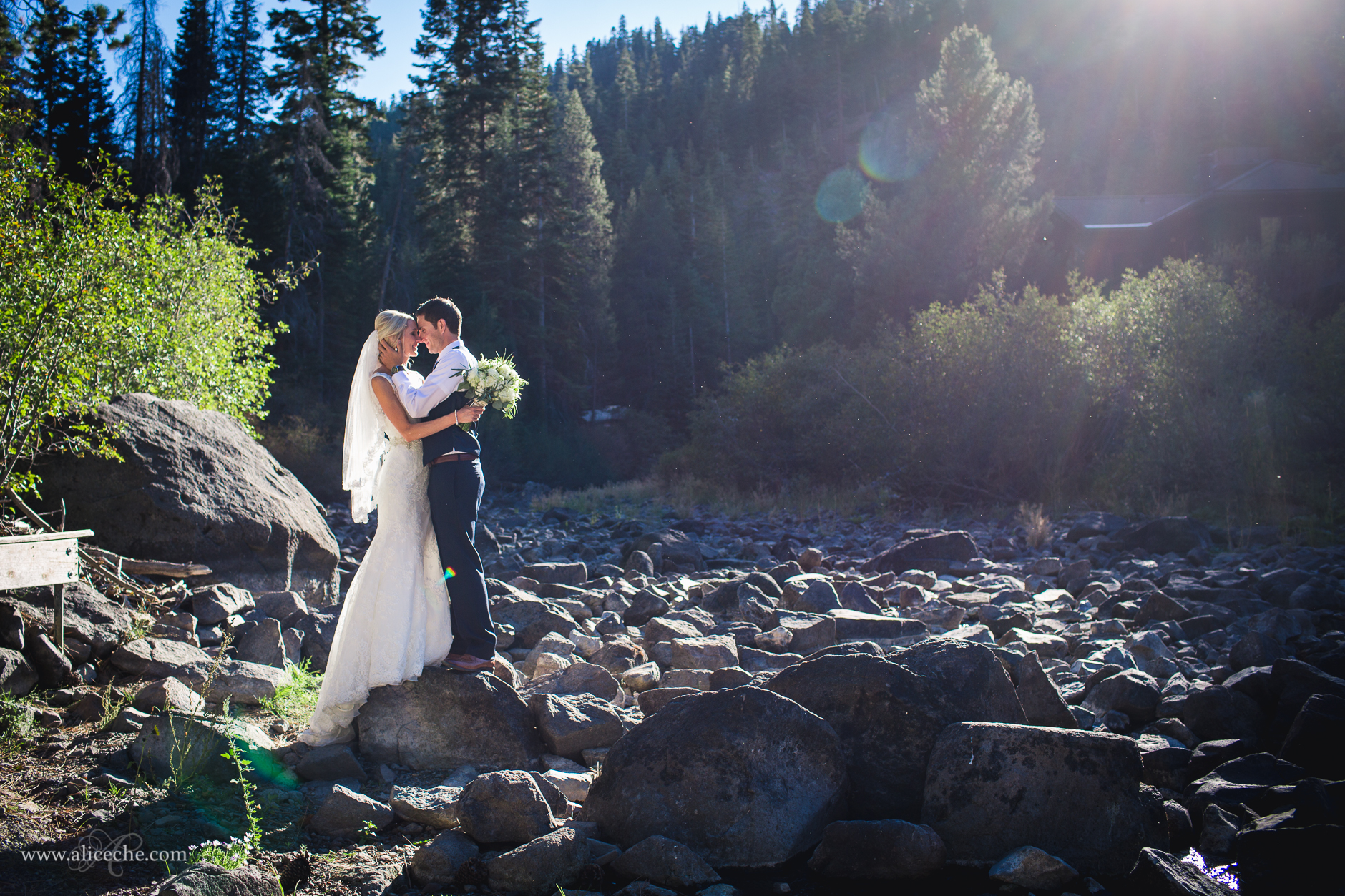 lake-tahoe-wedding-bride-groom-bridal-portraits-looking-lace-dress-sunflare