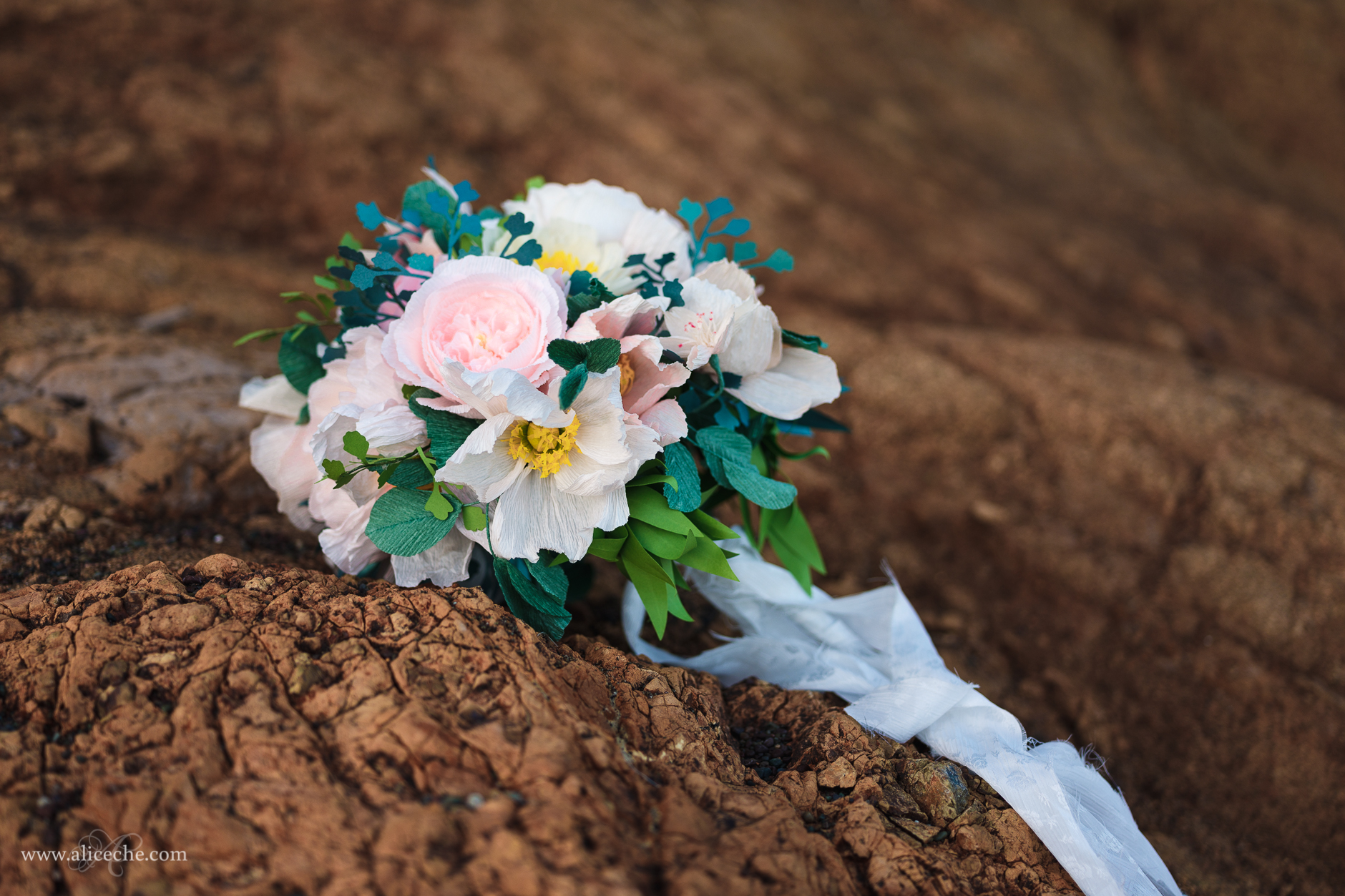 DIY Blush and cream crepe paper flower wedding bouquet on rocks