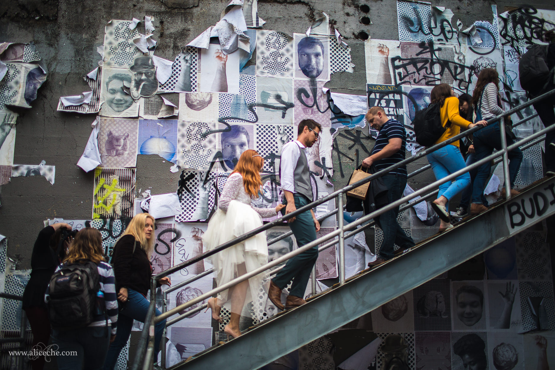 Downtown Seattle Styled Shoot Bride and Groom climbing stairs in front of graffiti