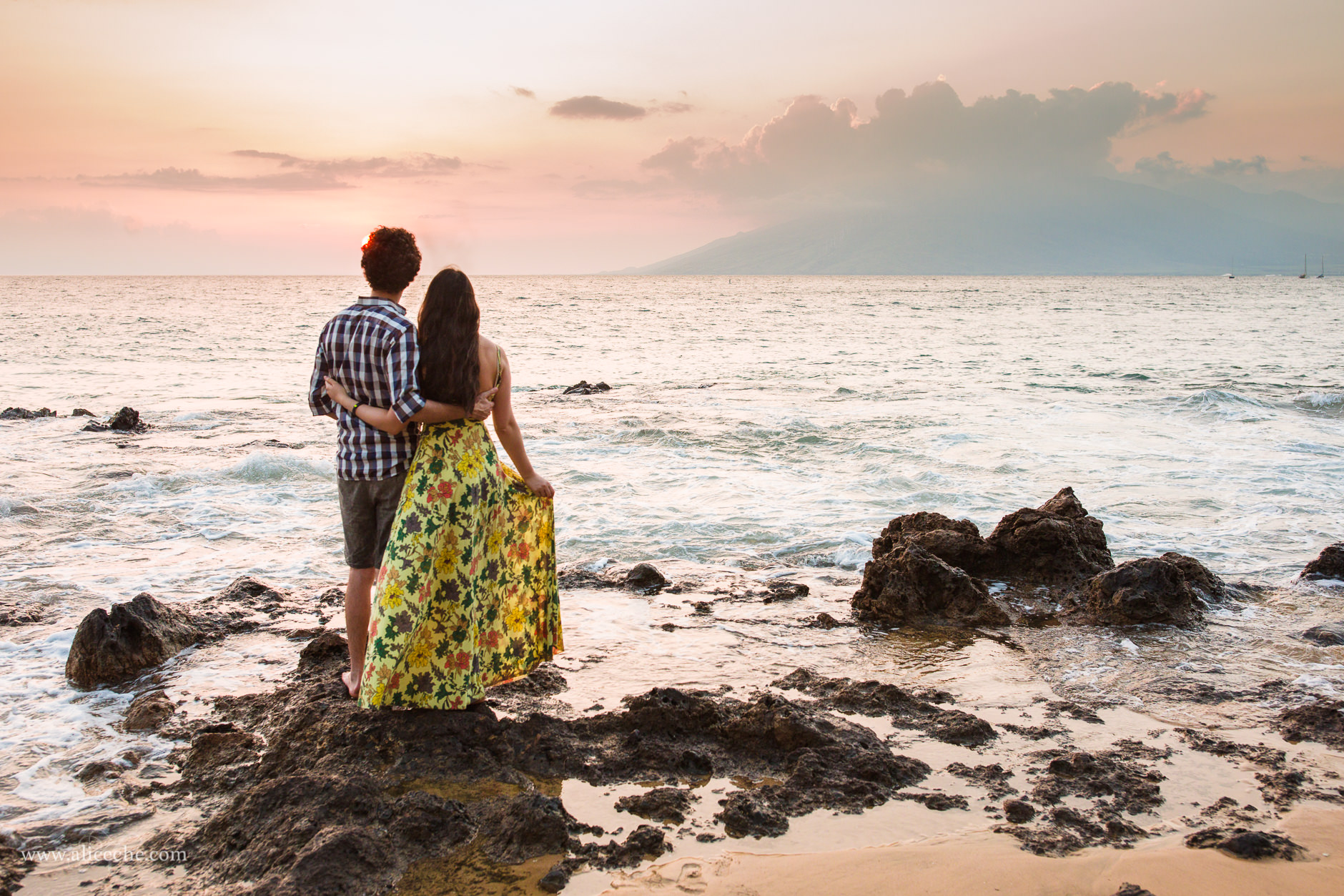 Couple watching sunset on Kamaole Beach II in Maui
