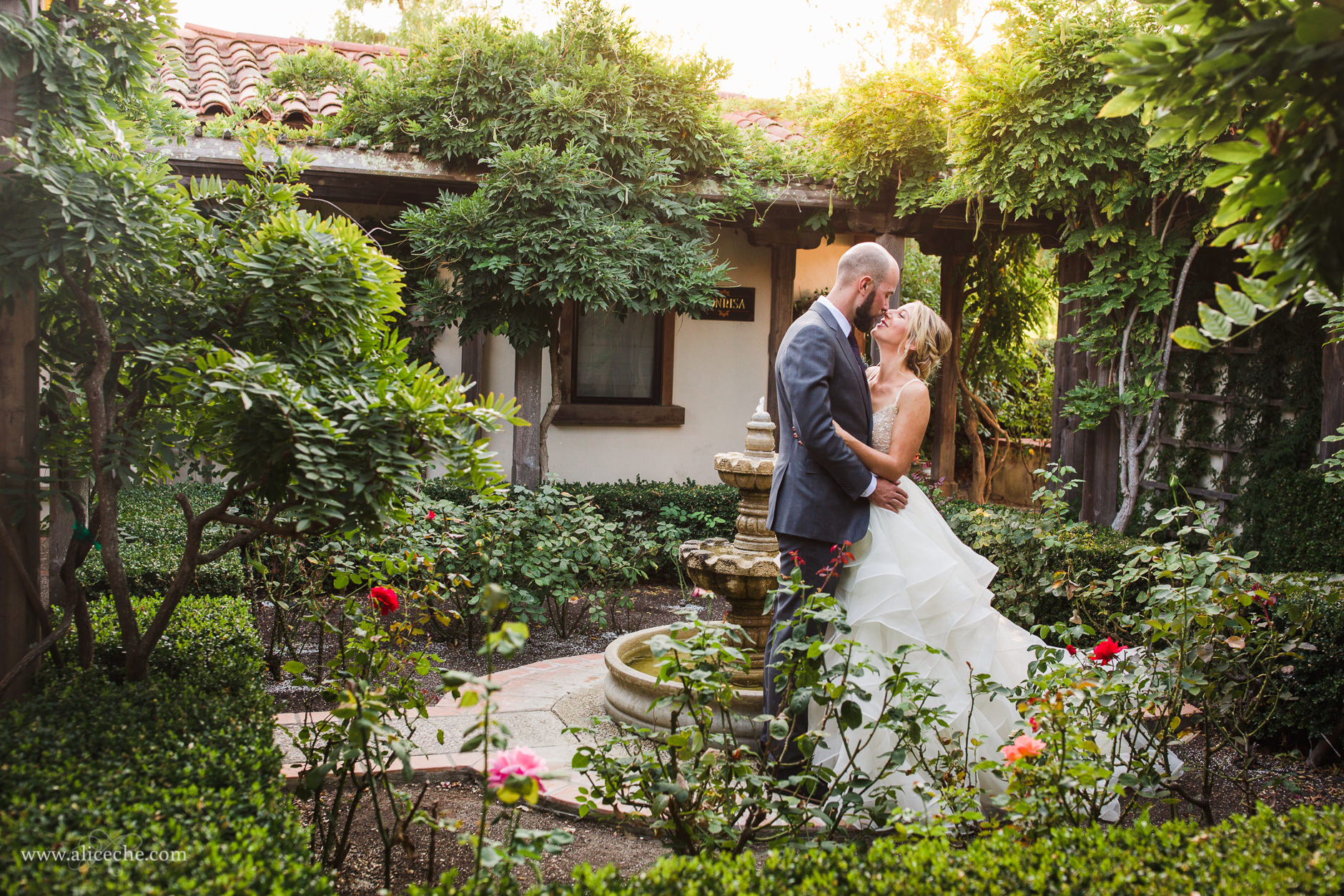 Beautiful San Luis Obispo Wedding Couple Kissing in Rose Garden at Casitas Estate