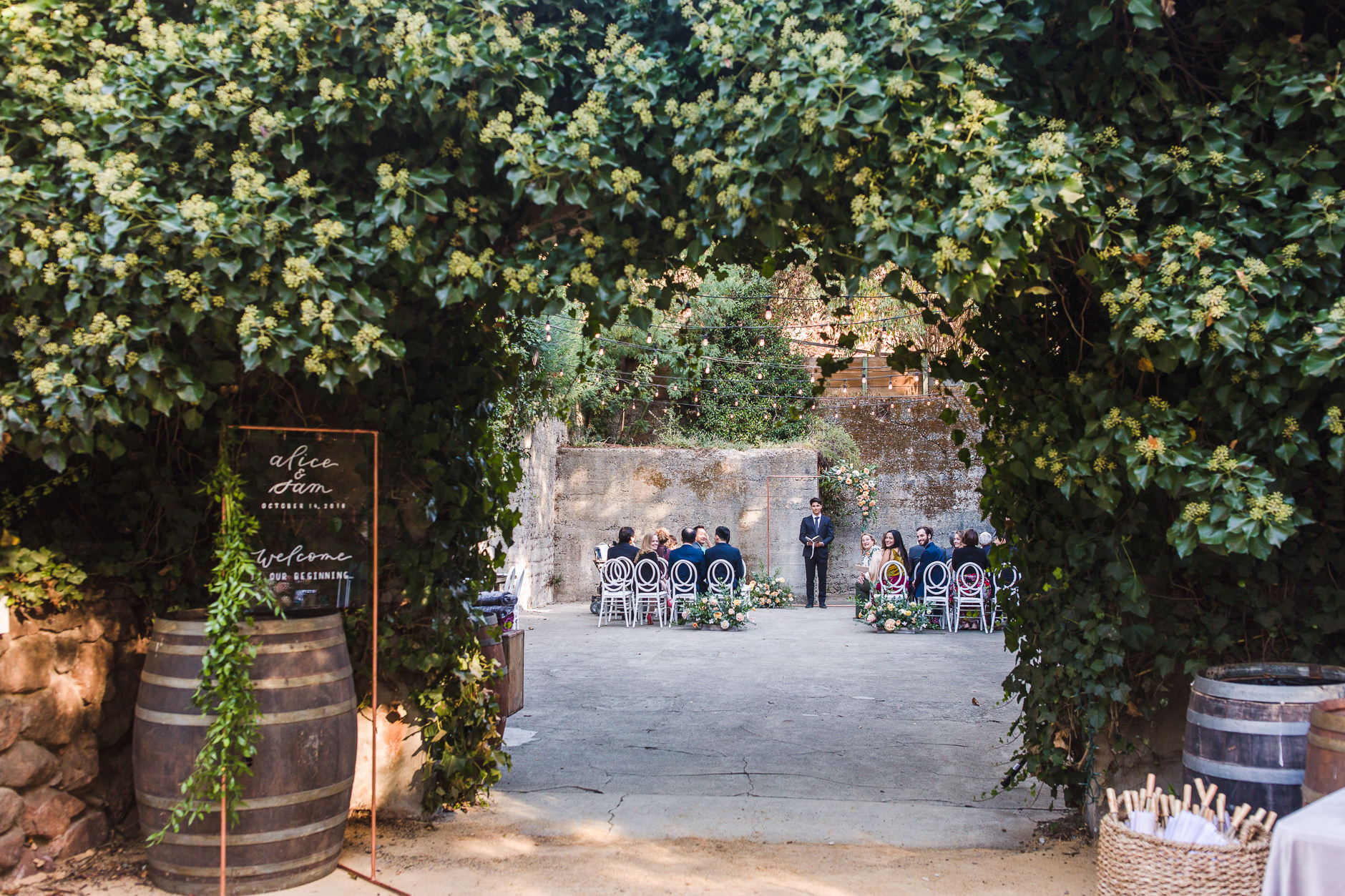 Wedding Ceremony set up in Barrel Room at Sand Rock Farm with stone walls and ivy covered entrance