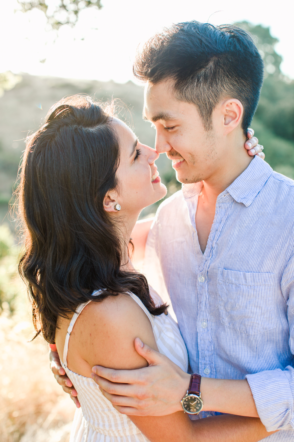Silicon Valley Engagement session, couple eskimo kissing in golden light
