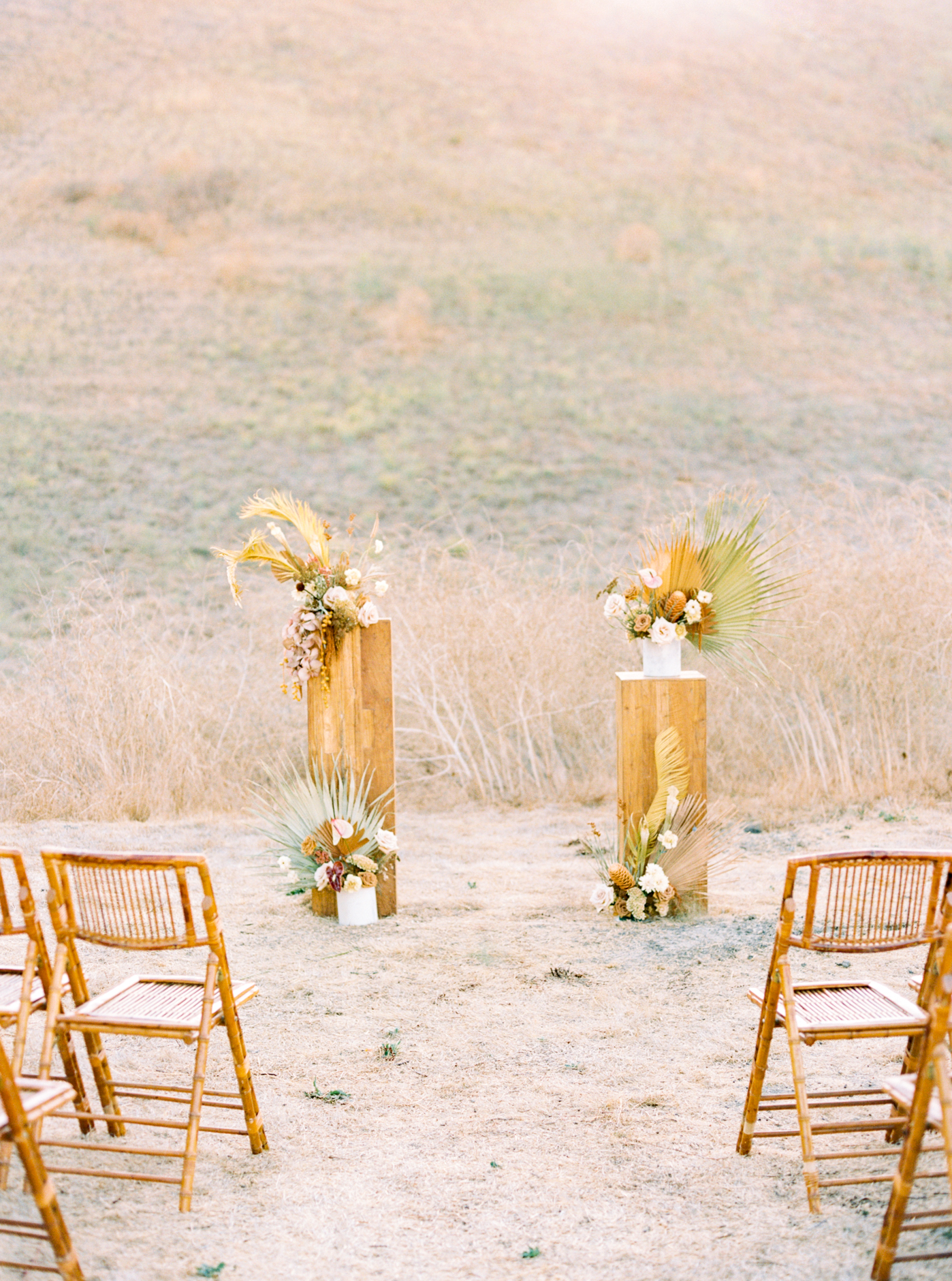 Beautiful ceremony setup at Reinstein Ranch Wedding in front of golden hill by Alice Che Photography