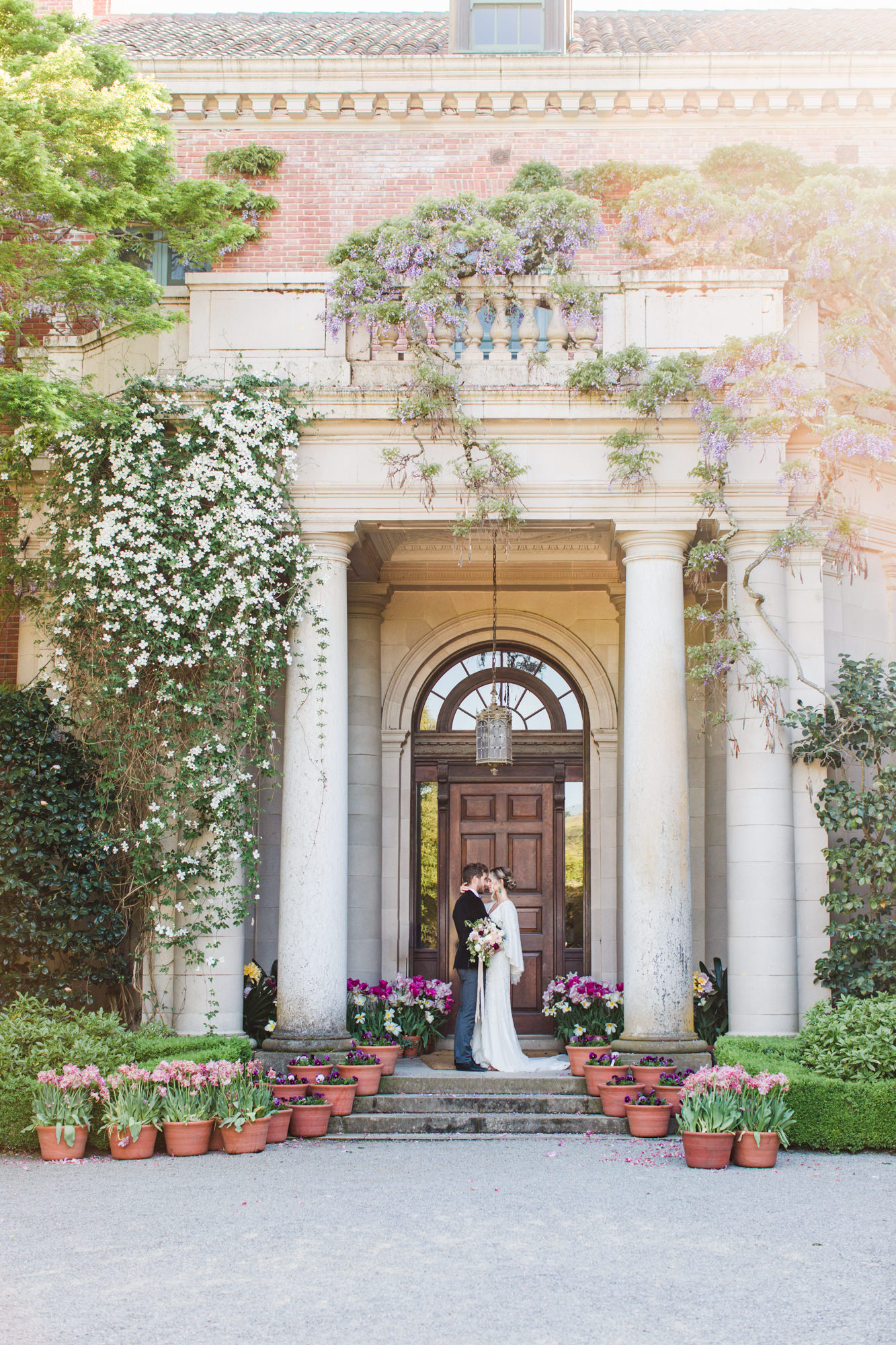 Bride and Groom at Filoli Garden Wedding in the Doorway of the Main House Entry Courtyard