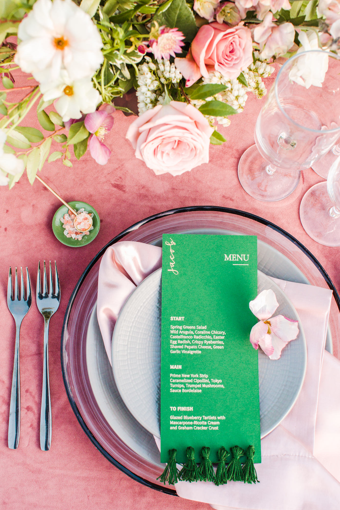 Green and gold foil printed menu with emerald tassels sewn to the bottom for a Filoli Garden wedding